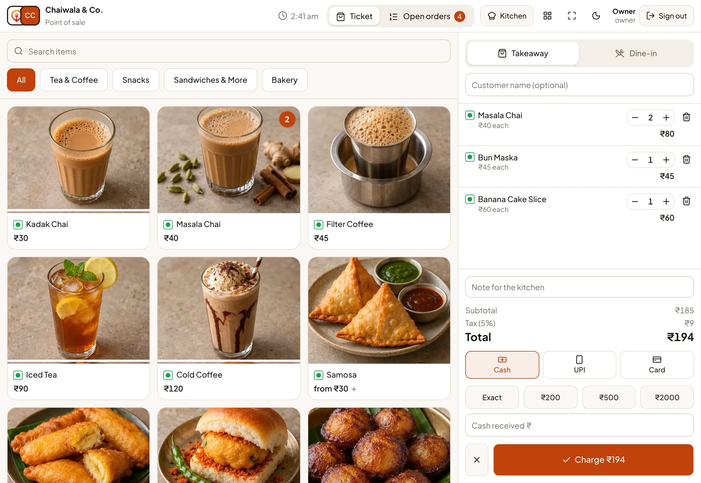 The counter POS of a café with a tea and snacks menu and a ticket